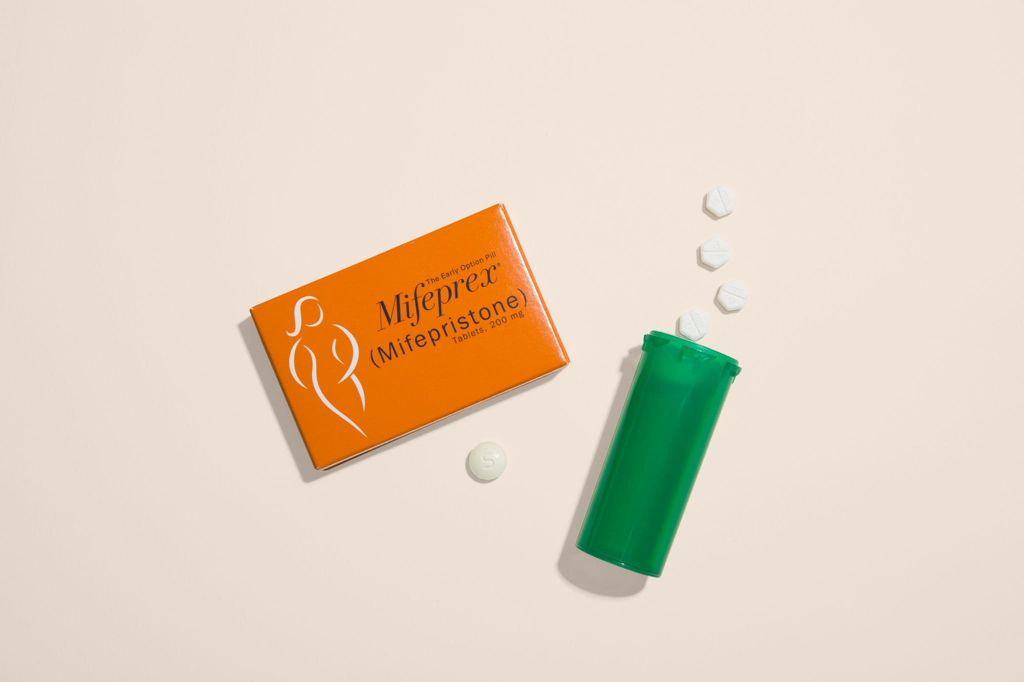 Beige abortion pill pills and green bottle rectangle Beige abortion pill pills and green bottle rectangle